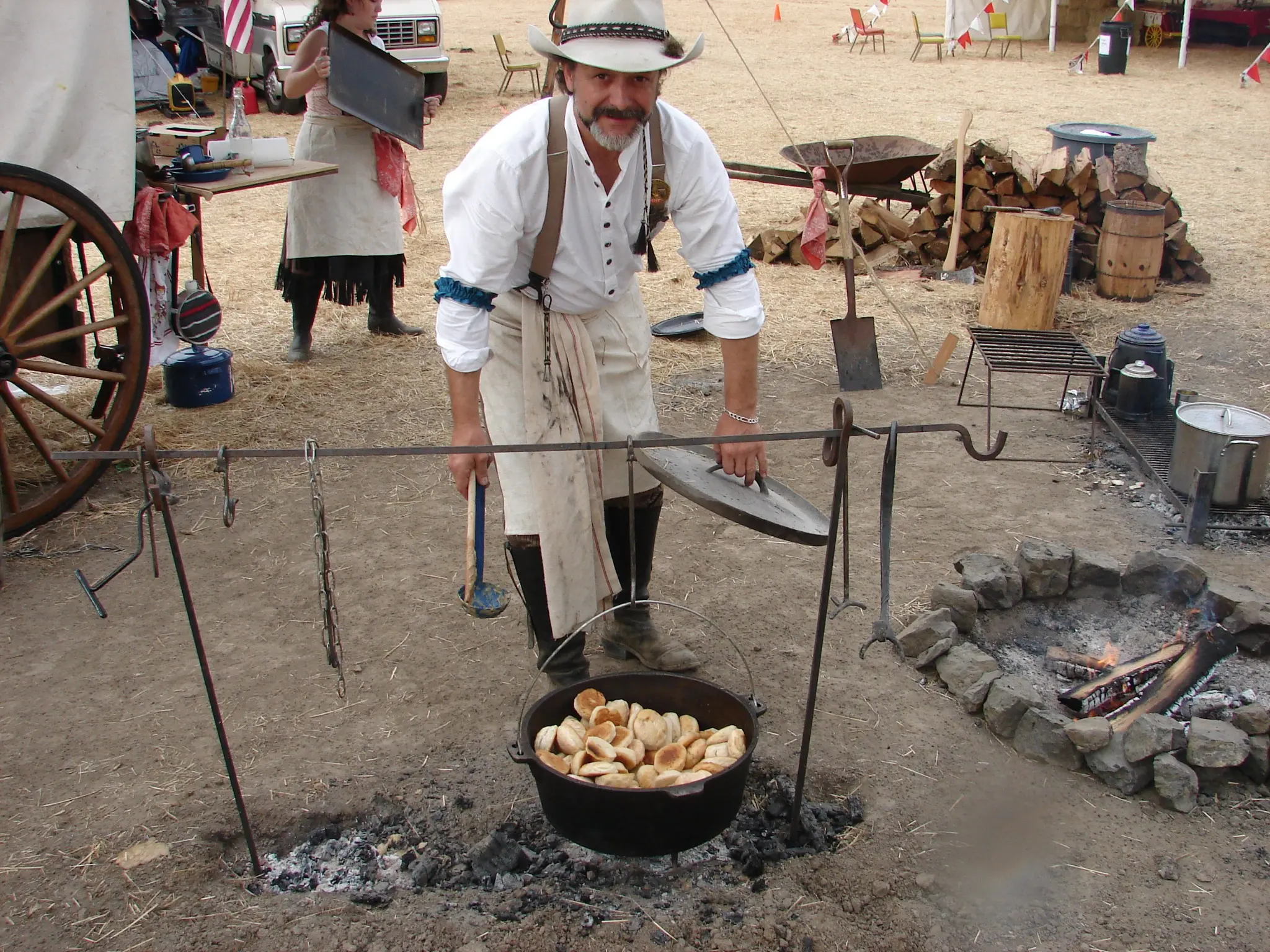 OOWSS member cooking over an open campfire